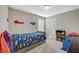Comfortable bedroom with carpeted floors and playful airplane decor, fostering a cheerful ambiance at 3164 Bormida Ave, Henderson, NV 89044