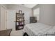 Well-lit bedroom with shelving, a secure safe, and a minimalist design at 3164 Bormida Ave, Henderson, NV 89044