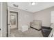 Neutral-toned Bedroom with a crib, soft chair, and direct access to a bathroom at 3164 Bormida Ave, Henderson, NV 89044