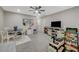 Spacious bonus room with neutral walls, carpeted floor, ceiling fan, and play area at 3164 Bormida Ave, Henderson, NV 89044