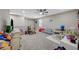 Spacious bonus room with neutral walls, carpeted floor, ceiling fan, and play area at 3164 Bormida Ave, Henderson, NV 89044