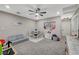 Spacious bonus room with neutral walls, carpeted floor, ceiling fan, and play area at 3164 Bormida Ave, Henderson, NV 89044