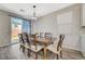Dining room area with wood table and chairs, plus backyard views at 3164 Bormida Ave, Henderson, NV 89044