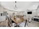 Dining area connecting to kitchen, complemented by white cabinets and modern appliances at 3164 Bormida Ave, Henderson, NV 89044