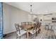 Inviting dining area with a wooden table and a view of the kitchen at 3164 Bormida Ave, Henderson, NV 89044