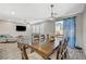Open floorplan view of the dining room, living room and outdoor access at 3164 Bormida Ave, Henderson, NV 89044