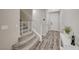 Inviting entryway with staircase, modern decor, and plenty of natural light at 3164 Bormida Ave, Henderson, NV 89044