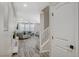 Foyer leading into a spacious living area with wood floors and stairs at 3164 Bormida Ave, Henderson, NV 89044