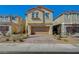 Charming two-story home featuring desert landscaping and a brick-paved driveway at 3164 Bormida Ave, Henderson, NV 89044
