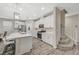 Open kitchen boasts a large island, white cabinets and new appliances at 3164 Bormida Ave, Henderson, NV 89044