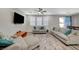 Bright living room boasts neutral tones, ceiling fan, and comfortable seating arrangement at 3164 Bormida Ave, Henderson, NV 89044