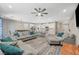 Spacious living room flowing into the kitchen with modern finishes and ample seating at 3164 Bormida Ave, Henderson, NV 89044