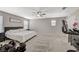 Large main bedroom with carpeted floor, ceiling fan, and two large windows at 3164 Bormida Ave, Henderson, NV 89044