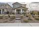 Charming two-story home featuring a welcoming front porch and professionally landscaped front yard at 3177 Bivona Walk, Henderson, NV 89044