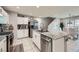 Open-concept kitchen featuring granite countertops, stainless steel appliances, and ample cabinet space at 3177 Bivona Walk, Henderson, NV 89044