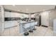 Stylish kitchen with a center island, white cabinetry, and modern stainless steel appliances at 3177 Bivona Walk, Henderson, NV 89044