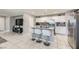 Modern kitchen featuring an island with seating, granite countertops, and stainless steel appliances at 3177 Bivona Walk, Henderson, NV 89044
