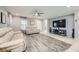 Spacious living room featuring modern furnishings, a ceiling fan, and stylish flooring at 3177 Bivona Walk, Henderson, NV 89044