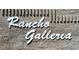 Rancho Galleria sign on a textured brick wall, in bright white lettering, clearly visible at 327 Perry Ellis Dr, Henderson, NV 89014