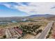 Scenic aerial perspective captures a community of red-roofed homes near a lake, offering a blend of desert beauty and waterfront charm at 3740 Desert Marina Dr # 3, Laughlin, NV 89029
