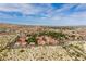 Bird's-eye view of a desert community featuring red-roofed townhomes, mature trees, and scenic mountain views in the distance at 3740 Desert Marina Dr # 3, Laughlin, NV 89029
