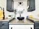 Modern bathroom with dual vanity countertop, vessel sink, and white shiplap walls for a clean look at 3740 Desert Marina Dr # 3, Laughlin, NV 89029