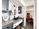 Stylish bathroom features a vessel sink on sleek countertop and black cabinets with an entrance view to bedroom at 3740 Desert Marina Dr # 3, Laughlin, NV 89029