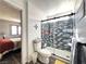 A renovated bathroom boasts a tiled shower with a sliding glass door and a view to a bedroom at 3740 Desert Marina Dr # 3, Laughlin, NV 89029