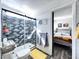 Modern bathroom featuring a tiled shower with sliding glass door and adjacent bedroom access at 3740 Desert Marina Dr # 3, Laughlin, NV 89029