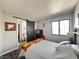 Bright bedroom with a sliding barn door leading to the bathroom; window with light filtering through at 3740 Desert Marina Dr # 3, Laughlin, NV 89029