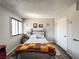 This cozy bedroom is well lit with a queen bed, sun decorations, and a large window at 3740 Desert Marina Dr # 3, Laughlin, NV 89029
