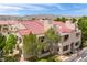 A residential building with a red tile roof is surrounded by lush green trees at 3740 Desert Marina Dr # 3, Laughlin, NV 89029