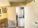 Compact laundry closet featuring a stacked washer and dryer in a utility area at 3740 Desert Marina Dr # 3, Laughlin, NV 89029