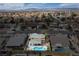 An aerial view highlights a well-maintained home with a private pool and hot tub in a neighborhood at 4322 Satinwood Dr, Las Vegas, NV 89147