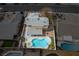 Aerial view of a well-kept home featuring a pool, hot tub and outdoor living area at 4322 Satinwood Dr, Las Vegas, NV 89147