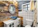 Coastal bathroom with wood accents and decorative mirror at 4322 Satinwood Dr, Las Vegas, NV 89147