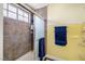Shower space with tiled wall and frosted sliding doors at 4322 Satinwood Dr, Las Vegas, NV 89147