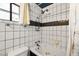 Bright bathroom features a soaking tub, shower head, and tiled walls at 4322 Satinwood Dr, Las Vegas, NV 89147