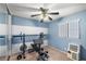 Bedroom features a ceiling fan, an AC unit, and exercise equipment at 4322 Satinwood Dr, Las Vegas, NV 89147