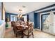 Elegant dining room boasts a chandelier, blue walls, and a decorative china cabinet at 4322 Satinwood Dr, Las Vegas, NV 89147