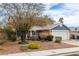 Charming two-story home with a well-maintained front yard, xeriscaping, and a two car garage at 4322 Satinwood Dr, Las Vegas, NV 89147