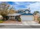Charming two-story home with a well-maintained front yard and a two car garage at 4322 Satinwood Dr, Las Vegas, NV 89147
