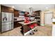 Modern kitchen with stainless steel appliances, a center island, and tile flooring at 4322 Satinwood Dr, Las Vegas, NV 89147