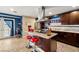 Modern kitchen with stainless steel appliances, a center island, and tile flooring at 4322 Satinwood Dr, Las Vegas, NV 89147