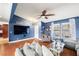 Inviting living room with hardwood floors, large TV, and ample seating for relaxing at 4322 Satinwood Dr, Las Vegas, NV 89147