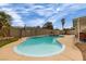 Relaxing backyard pool features a basketball hoop, lounge area, and easy access from the house at 4322 Satinwood Dr, Las Vegas, NV 89147