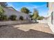 Backyard featuring gravel, retaining wall, and block fence at 4439 Yellow Harbor St, Las Vegas, NV 89129
