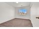 Cozy bedroom with neutral carpet, natural light, and closet at 4439 Yellow Harbor St, Las Vegas, NV 89129