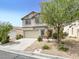 Charming two-story home with a well-manicured front yard and attached two-car garage at 4439 Yellow Harbor St, Las Vegas, NV 89129