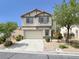 Charming two-story home with a well-manicured front yard and attached two-car garage at 4439 Yellow Harbor St, Las Vegas, NV 89129